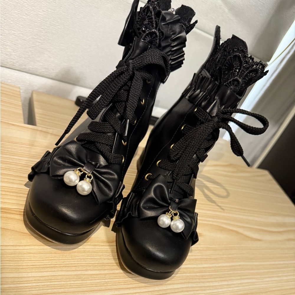 Chic Black Lace-Up Boots with Pearl Accent